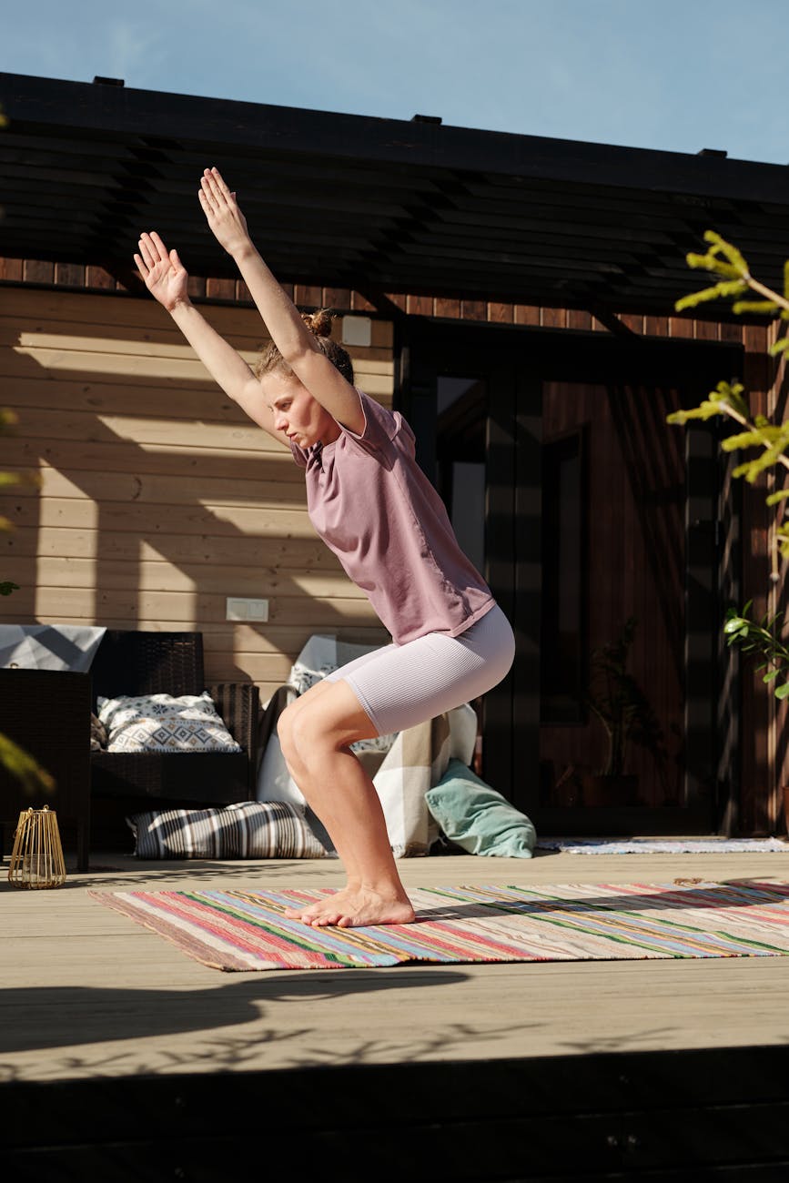 Person sitting in a meditative pose after a workout, looking serene and energized.